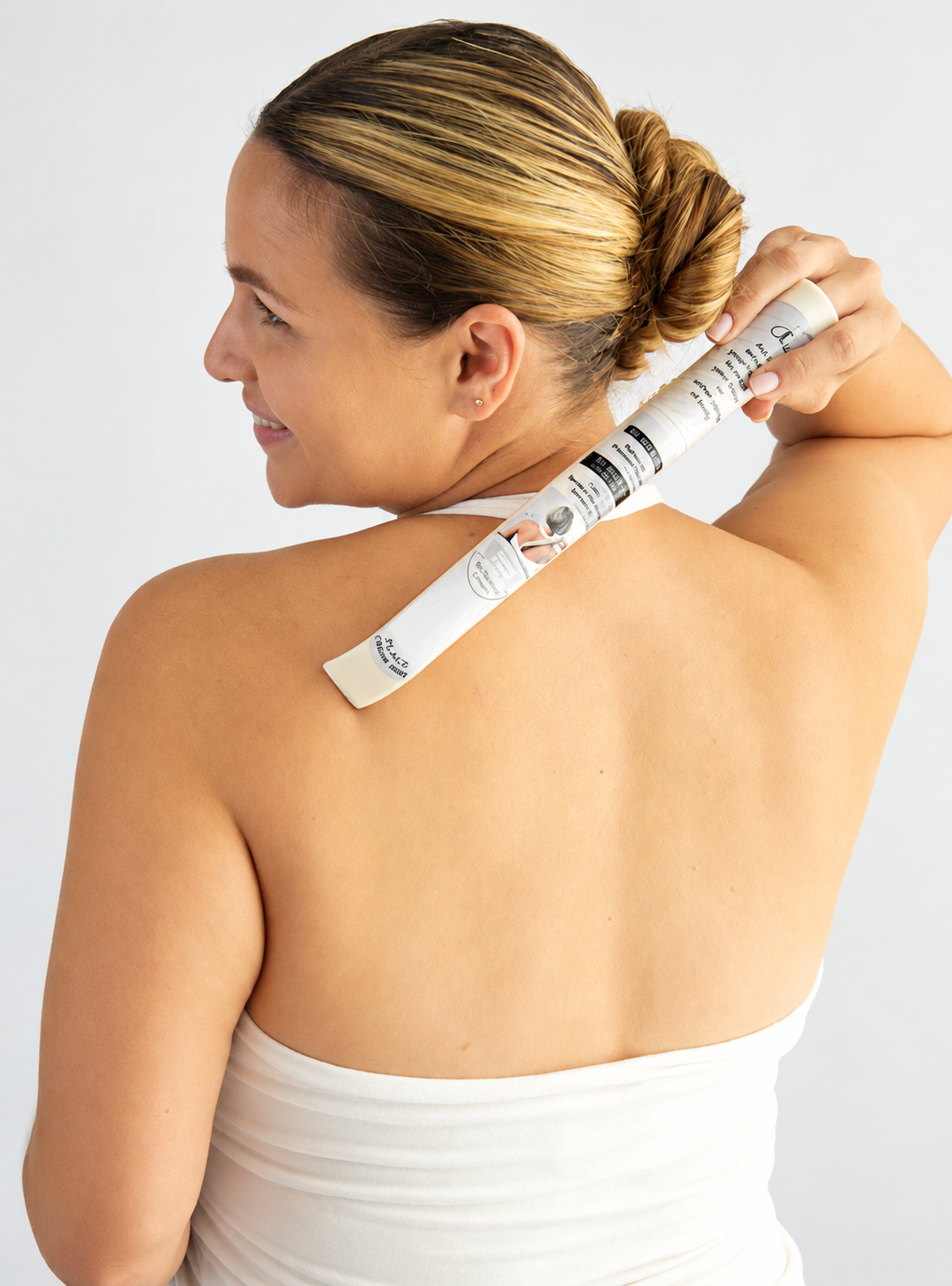 The Extend Your Finger Tool being used to reach the back